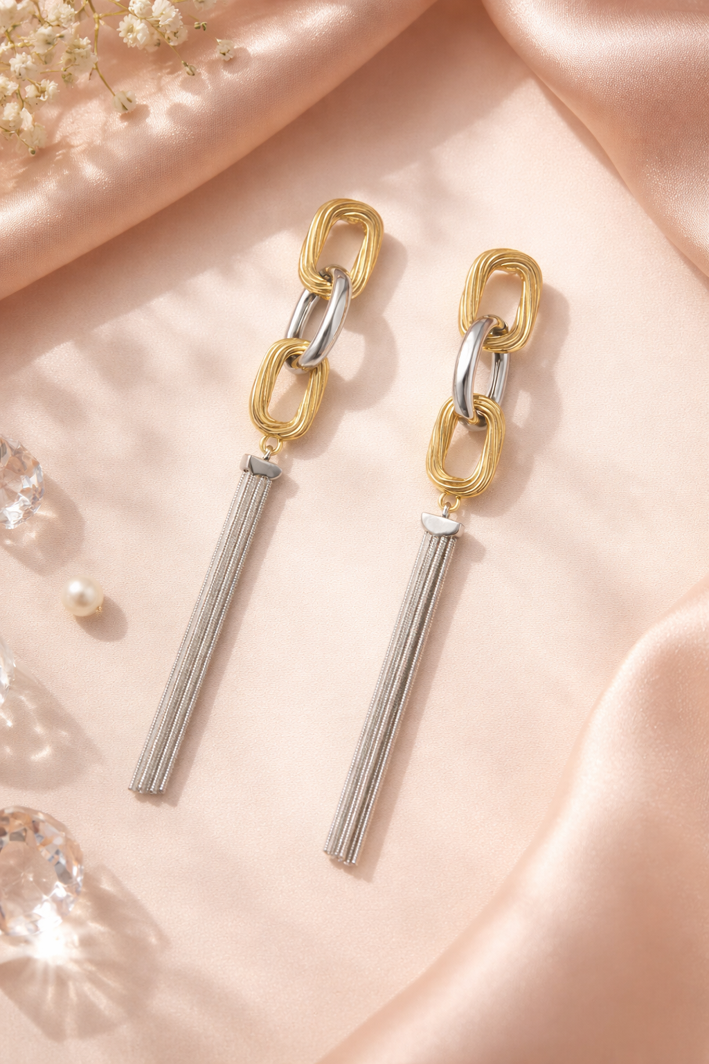 Anti-Tarnish, Ashaarya, Ashaarya Jewels, Ashaarya Jewellery, Gold and silver chain earrings on a pink fabric background