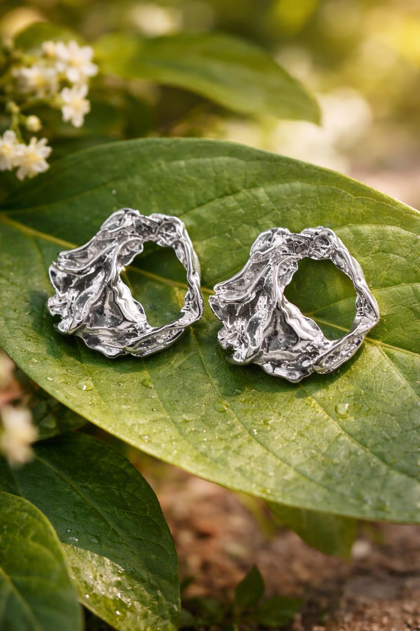 Anti-Tarnish, Ashaarya, Ashaarya Jewels, Ashaarya Jewellery, Silver earrings on a green leaf with a natural background