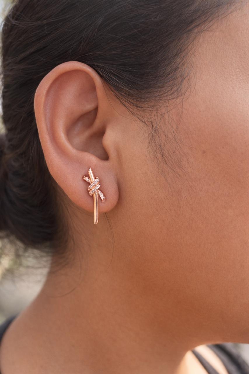 Anti-Tarnish, Ashaarya, Ashaarya Jewels, Ashaarya Jewellery, Close-up of an ear wearing a rose gold earring with floral design.
