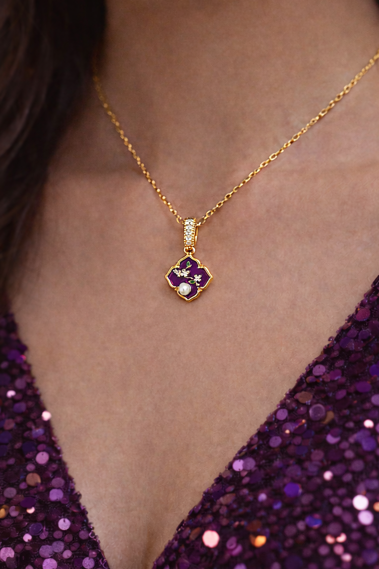 Anti-Tarnish, Ashaarya, Ashaarya Jewels, Ashaarya Jewellery, Gold necklace with a pendant worn by a person in a purple sequin top.