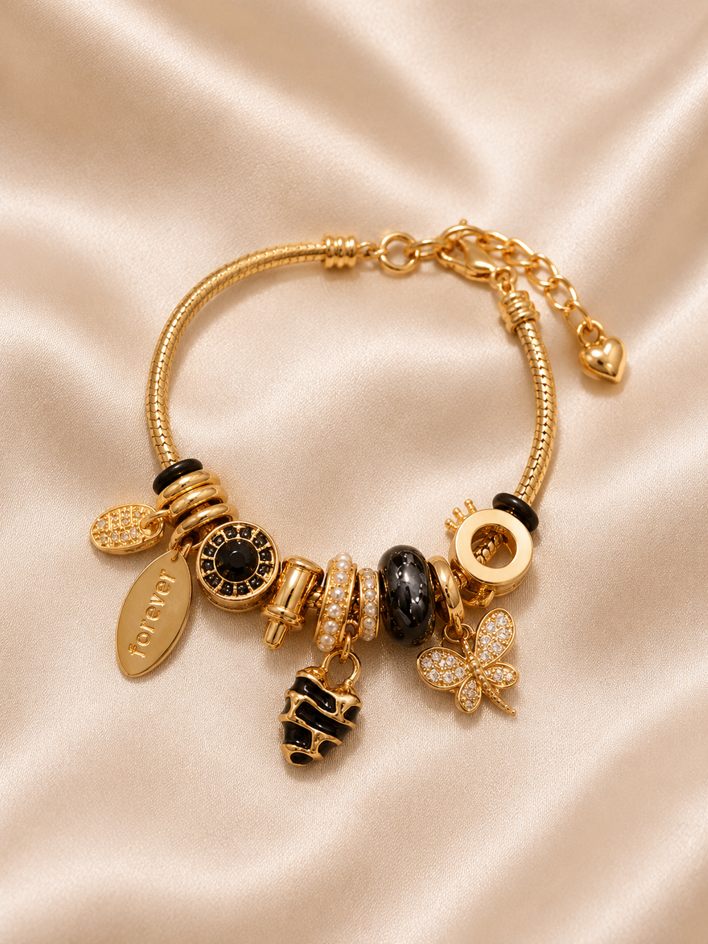 Discover the Midnight Monarch Charm Bracelet by Ashaarya. Crafted from 316L stainless steel with an 18KT gold tone finish, anti-tarnish, lightweight and skin-friendly.