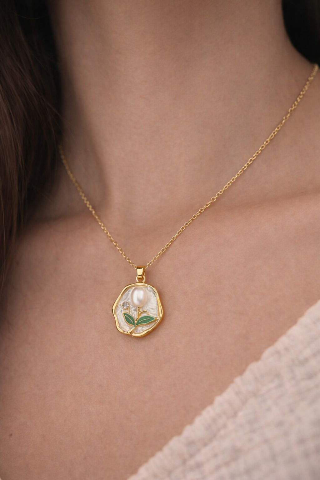 Anti-Tarnish, Ashaarya, Ashaarya Jewels, Ashaarya Jewellery, Gold necklace with a pendant featuring a floral design on a person's neck.