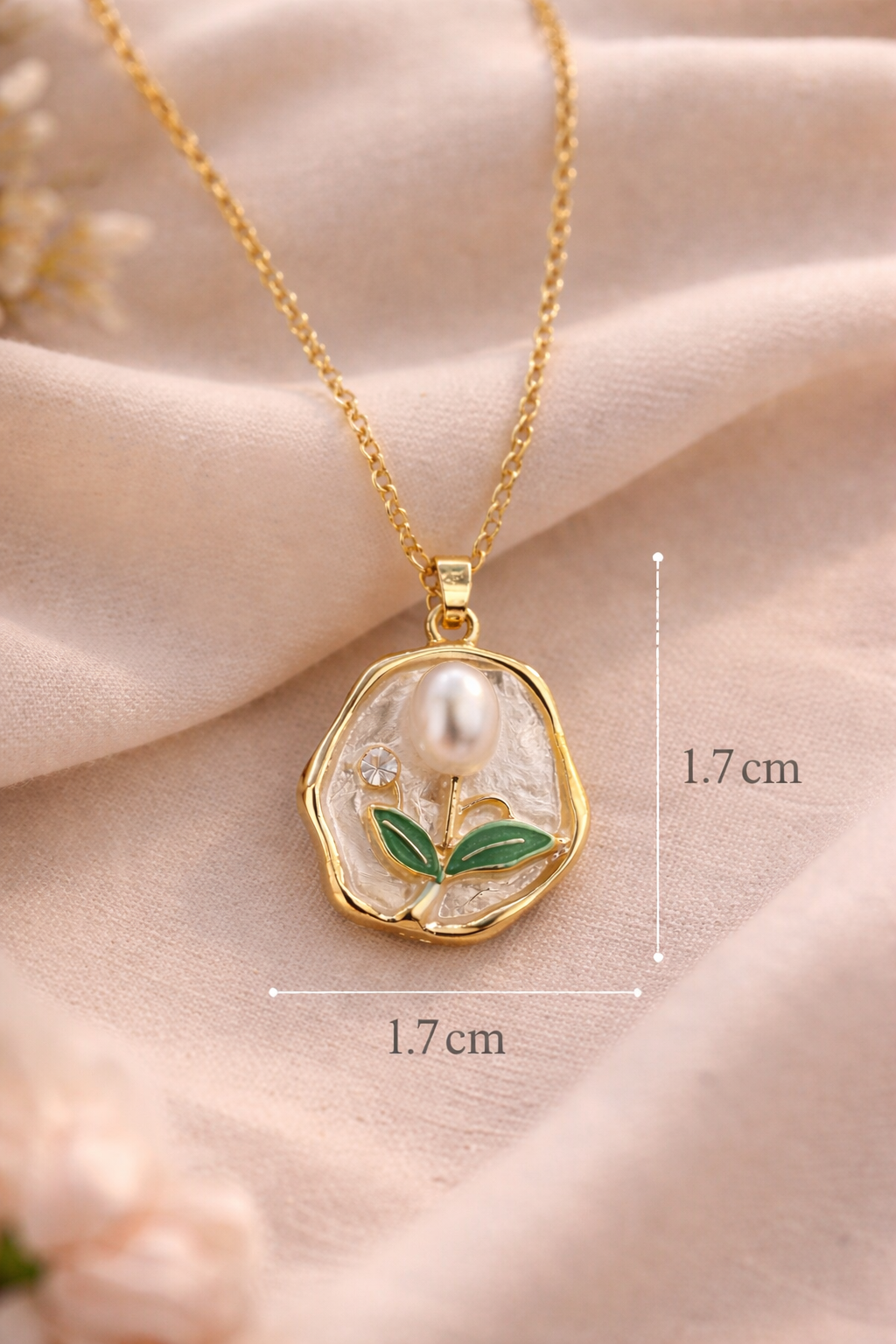Anti-Tarnish, Ashaarya, Ashaarya Jewels, Ashaarya Jewellery, Gold necklace with a pendant on a soft pink fabric background