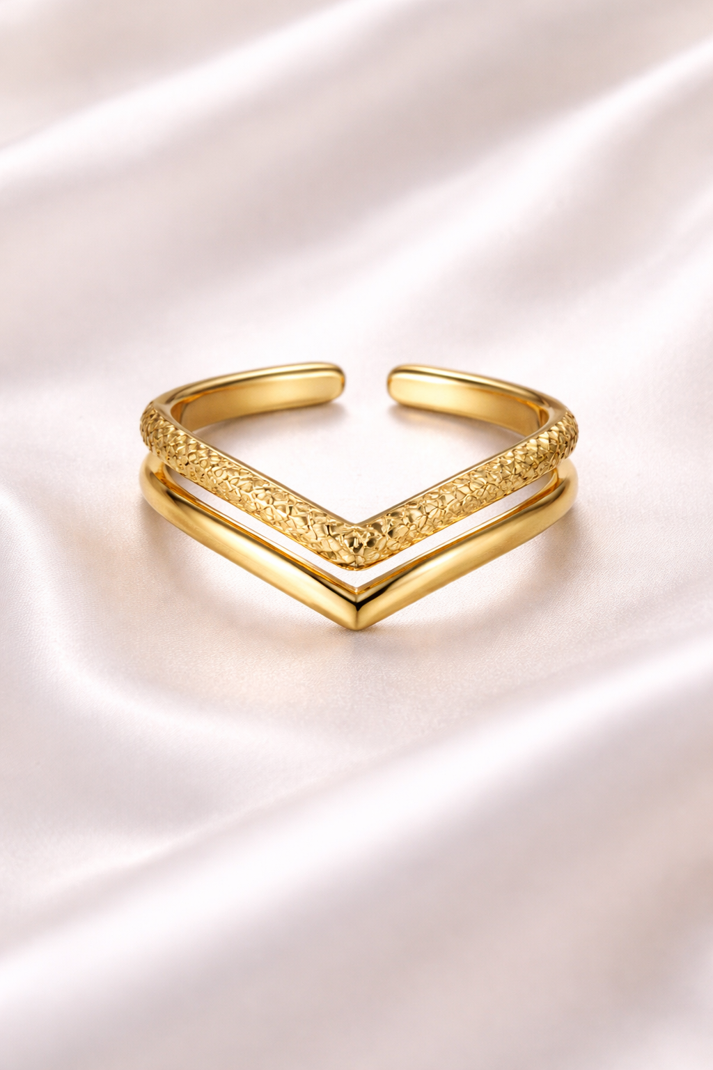 Anti tarnish V shaped chevron adjustable ring in gold finish – comfort jewellery silver rings for girls by Ashaarya Gold bracelet with a chevron design on a white satin background