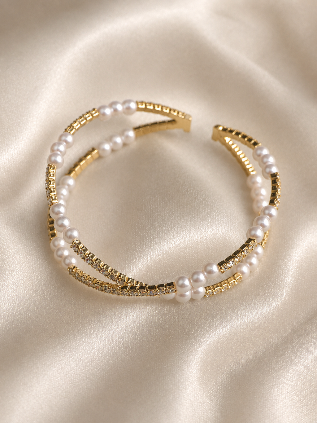 American diamond detailing on the gold-tone Pearl Luxe Cuff Bracelet by Ashaarya