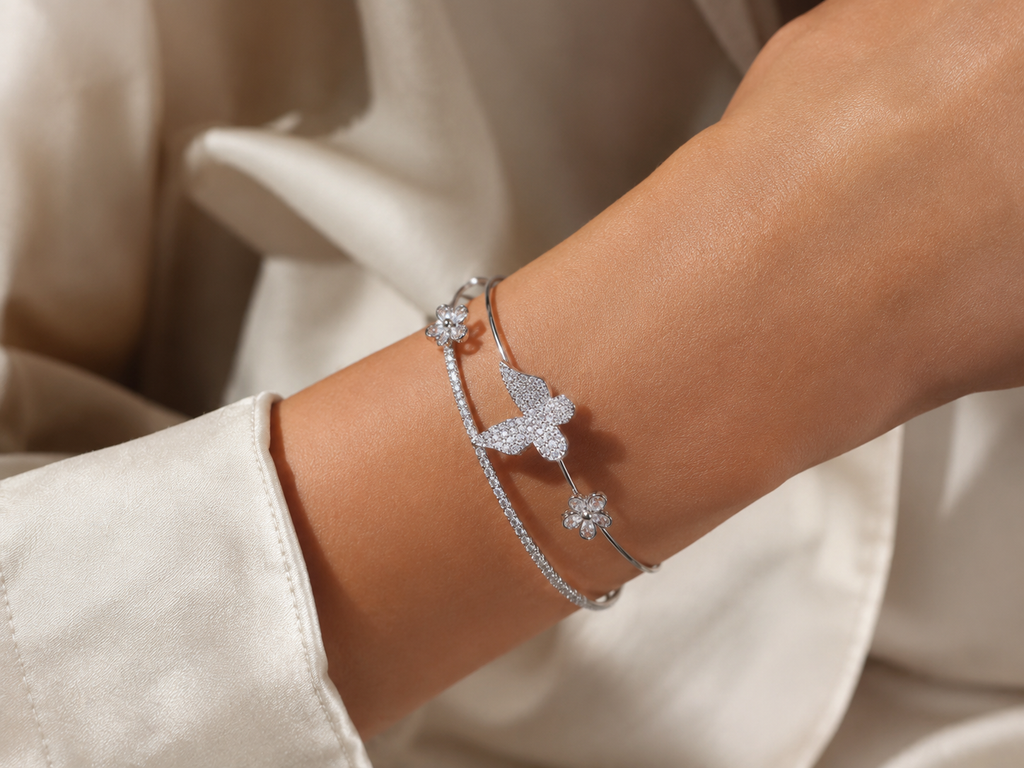 Silver-tone butterfly and floral bracelet by Ashaarya styled with an elegant outfit for everyday and occasion wear.