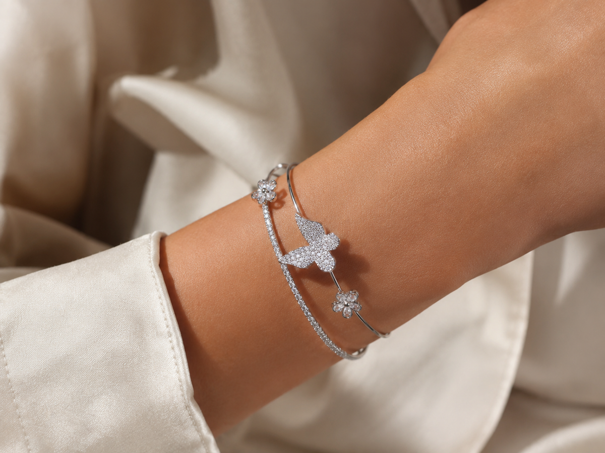 Silver-tone butterfly and floral bracelet by Ashaarya styled with an elegant outfit for everyday and occasion wear.