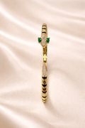 anti-tarnish comfort jewellery snake bracelet for women with American diamonds and emerald stones in 18kt gold tone luxury bracelet