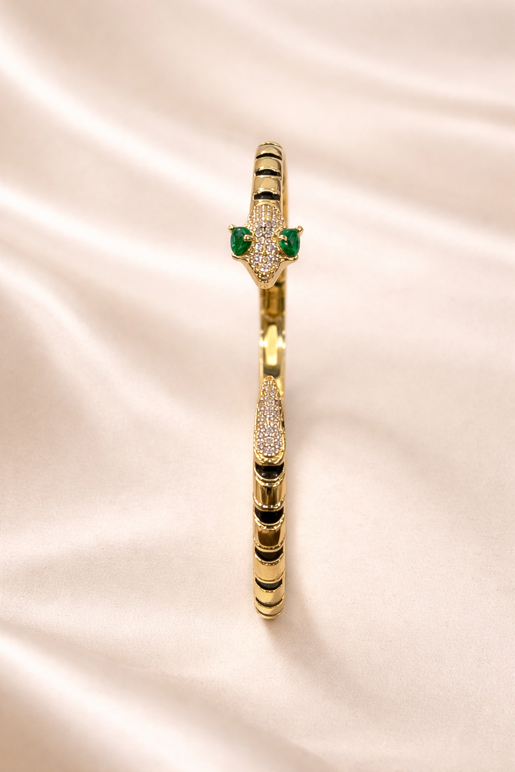 anti-tarnish comfort jewellery snake bracelet for women with American diamonds and emerald stones in 18kt gold tone luxury bracelet