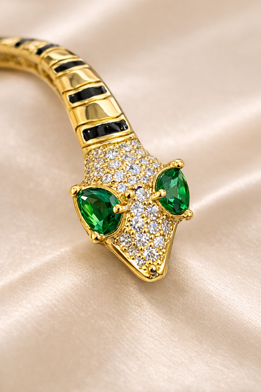 anti-tarnish comfort jewellery snake bracelet for women with American diamonds and emerald stones in 18kt gold tone luxury bracelet