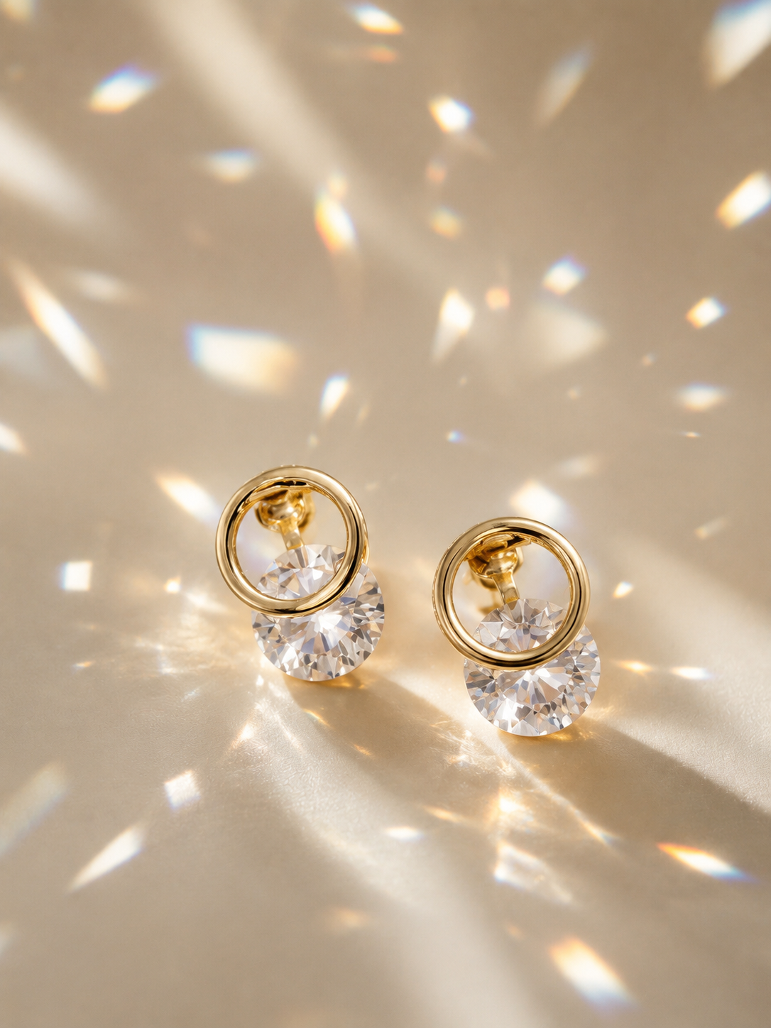 Anti-tarnish crystal clip-on earrings with a polished gold-tone finish and brilliant round stone detailing