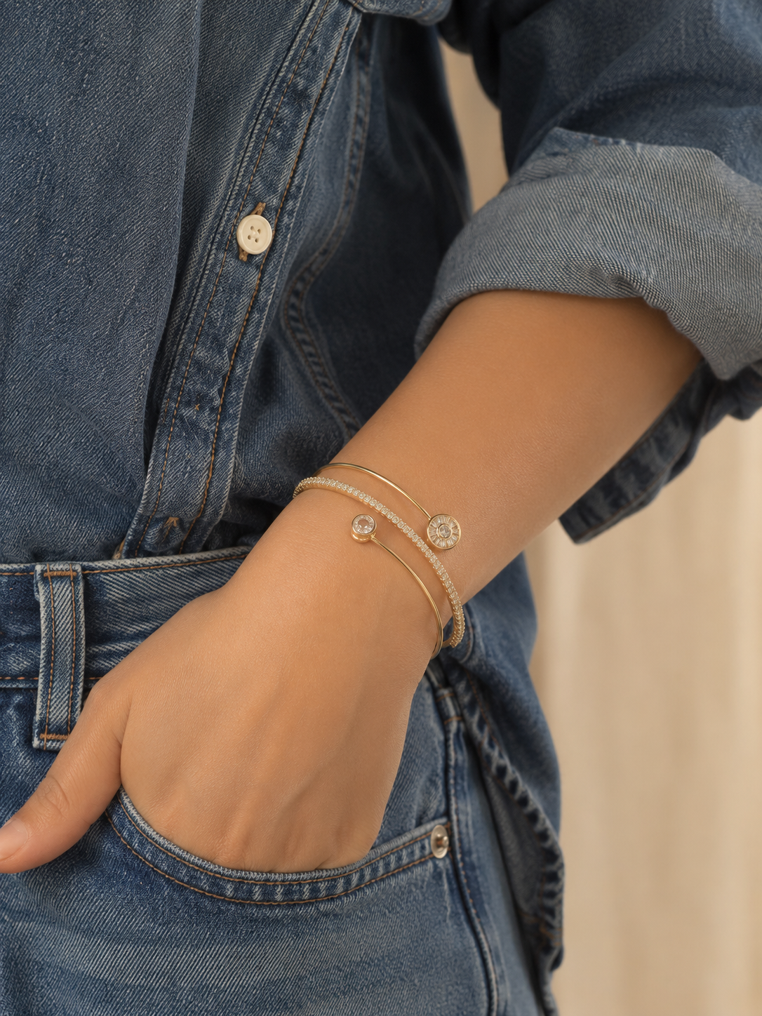Anti-tarnish gold bracelet stack for women featuring multiple sleek bands with sparkling stone detailing