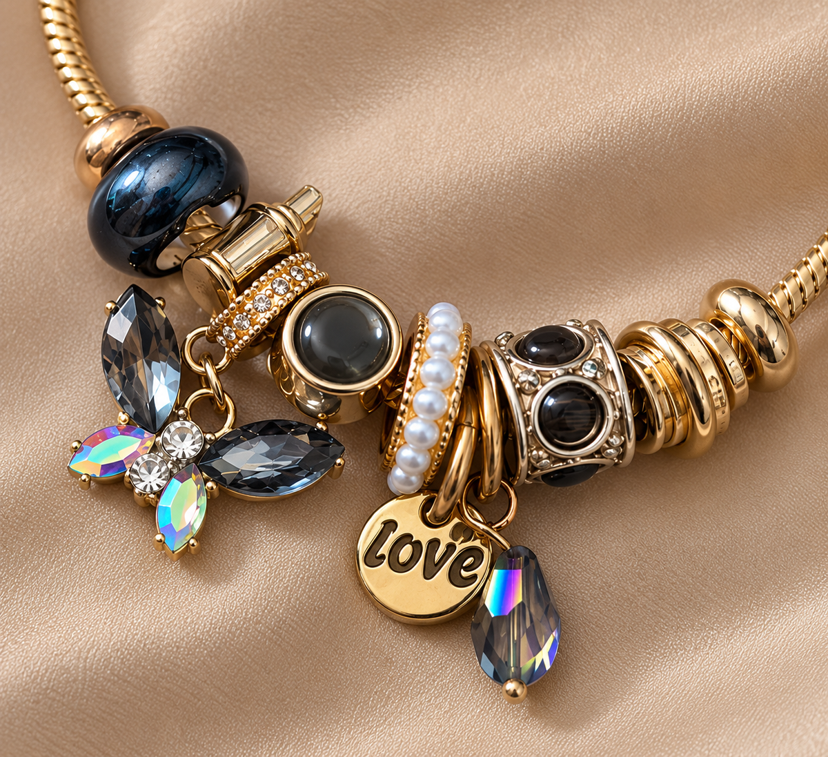 Ashaarya Midnight Love gold-tone charm bracelet featuring 9 decorative charms, anti-tarnish detailing and a 316L stainless steel base metal.