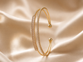 Anti-tarnish gold crystal open cuff bracelet for women featuring dual rows of sparkling stones and elegant gold-tone detailing