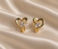 Anti-tarnish gold heart-shaped clip-on earrings with sparkling clear centre stone by Ashaarya, delicate comfort jewellery for women