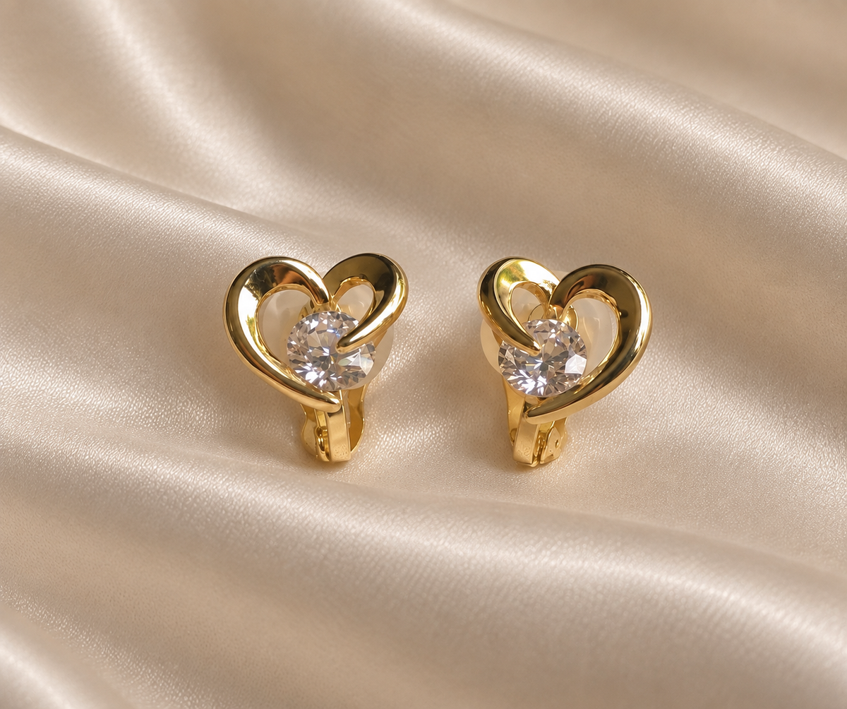 Anti-tarnish gold heart-shaped clip-on earrings with sparkling clear centre stone by Ashaarya, delicate comfort jewellery for women