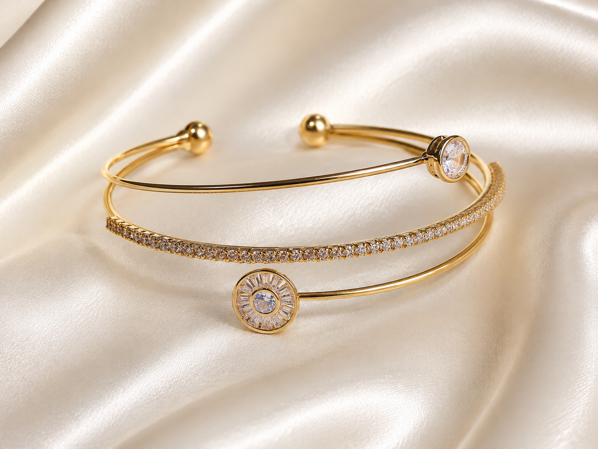 Anti-tarnish gold layered bracelet for women with delicate crystal detailing and a minimalist open cuff design