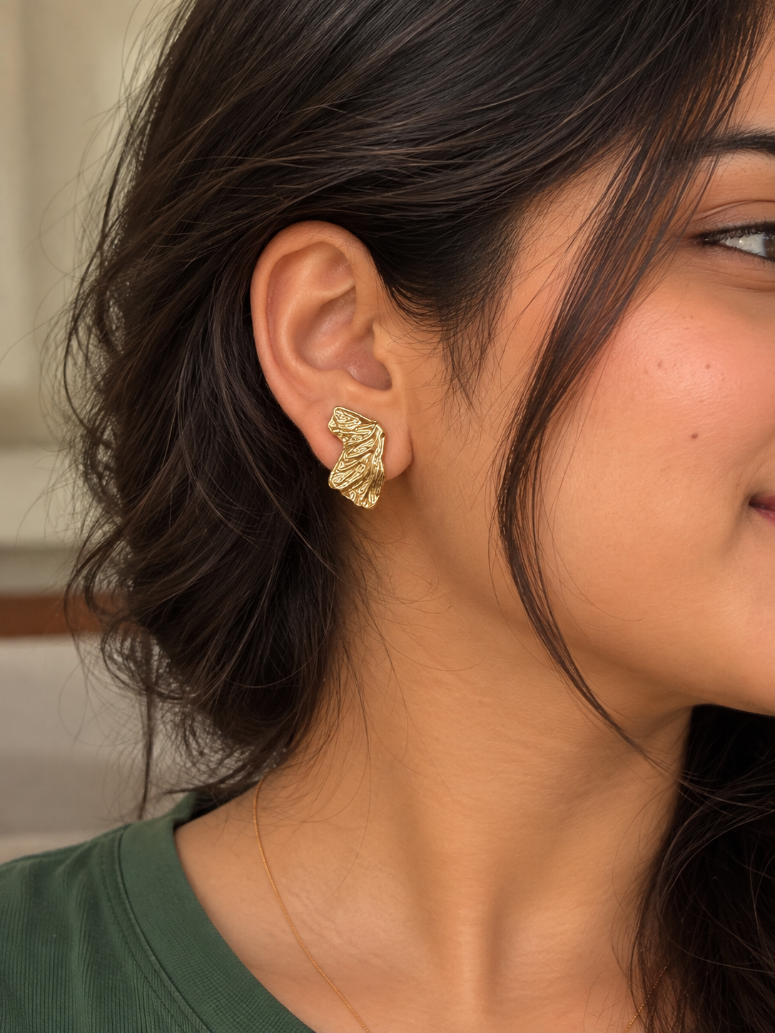 Anti-tarnish gold ribbed clip-on earrings featuring a flowing sculptural silhouette, premium comfort jewellery for women