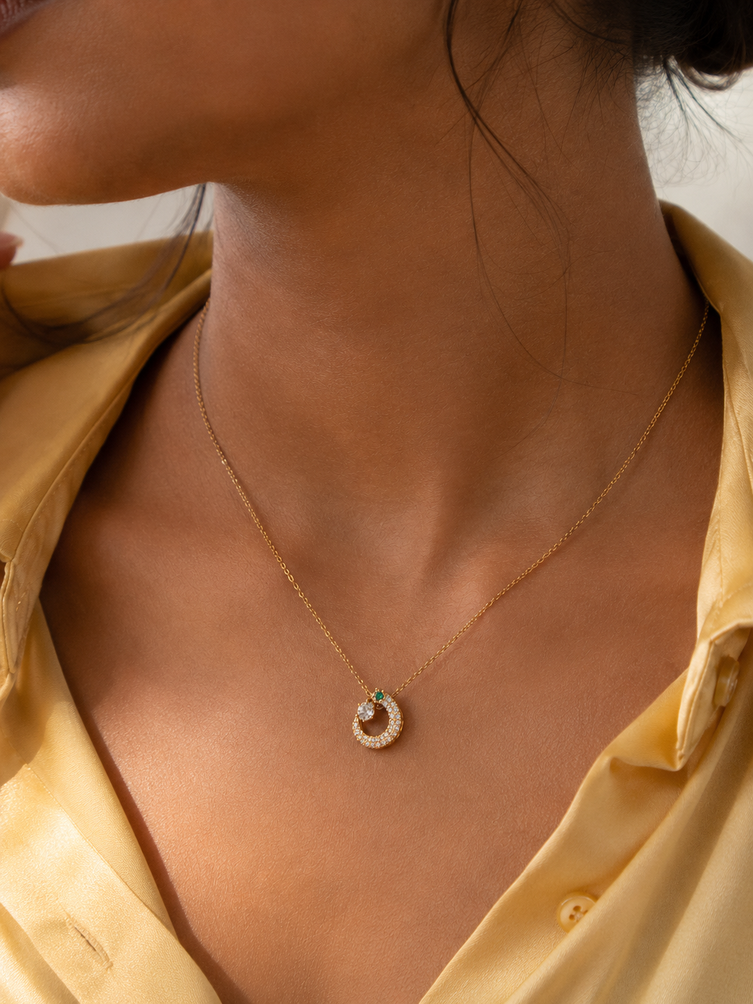 Gold-tone Emerald Serpent Necklace styled on a model by Ashaarya