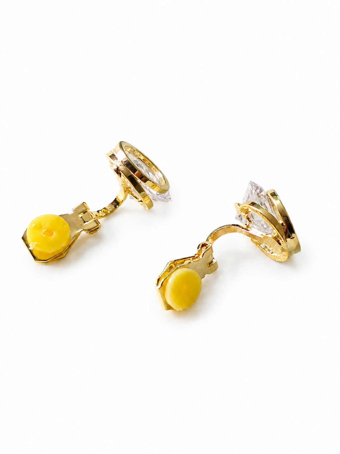 Anti-tarnish gold statement clip-on earrings with faceted crystal detailing, polished metal finish and comfortable no-piercing design