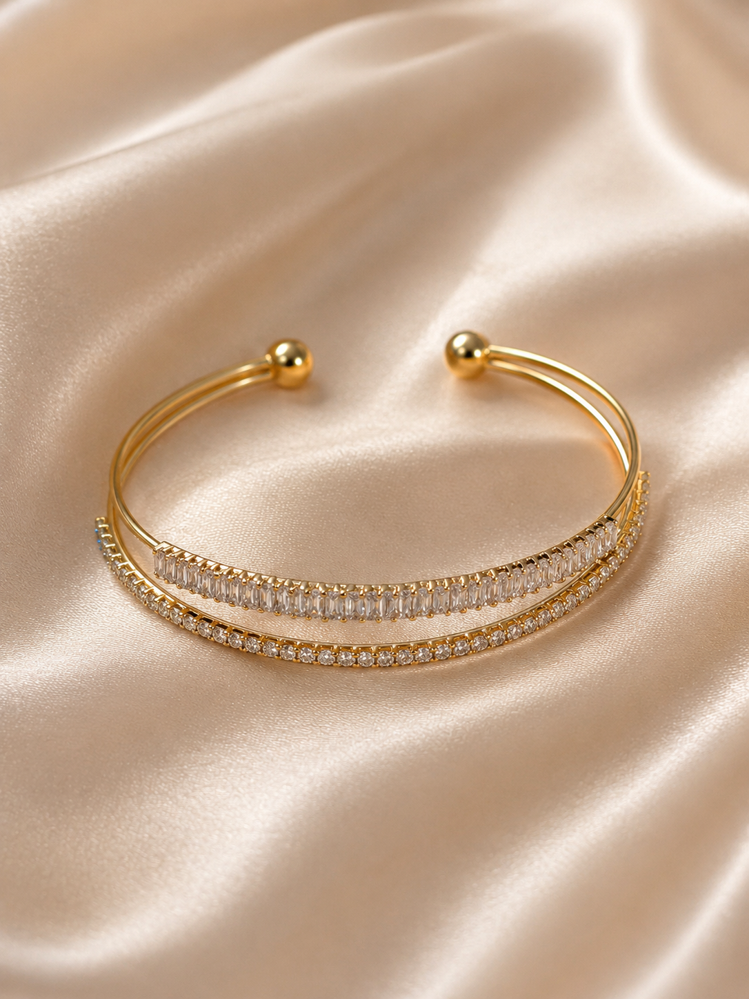 Anti-tarnish gold stone bracelet for women featuring a sleek open-ended silhouette and two rows of sparkling crystal accents