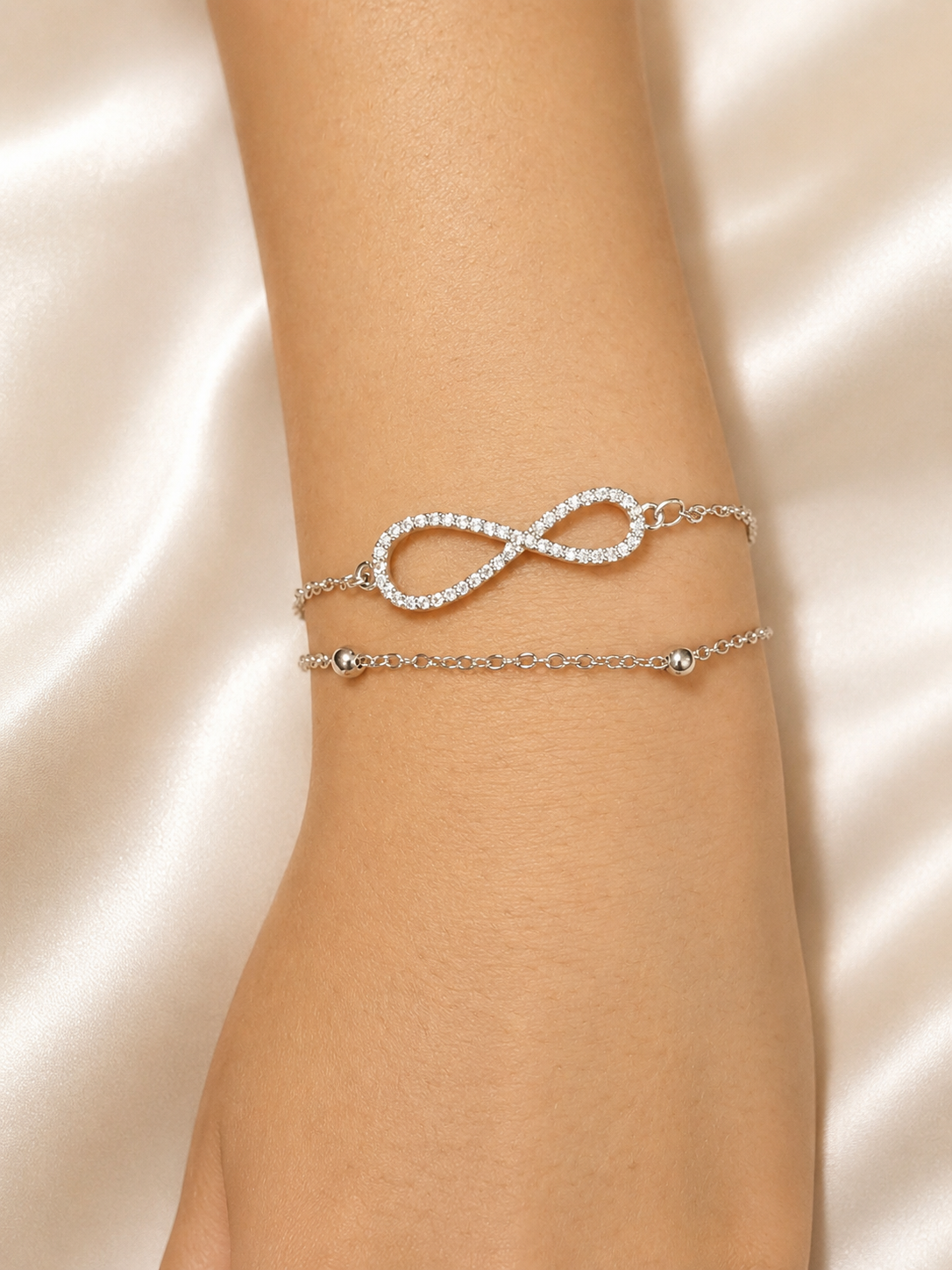 Close-up of the Infinite Journey Bracelet by Ashaarya featuring a sparkling infinity charm on a lightweight anti-tarnish silver bracelet.