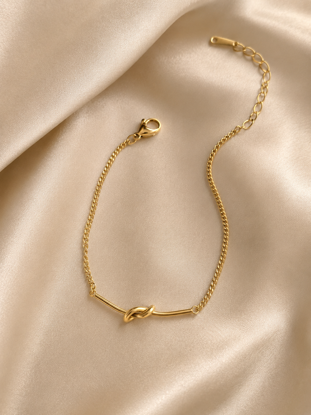 Anti-tarnish gold knot bracelet for women crafted from stainless steel with a minimalist design by Ashaarya.
