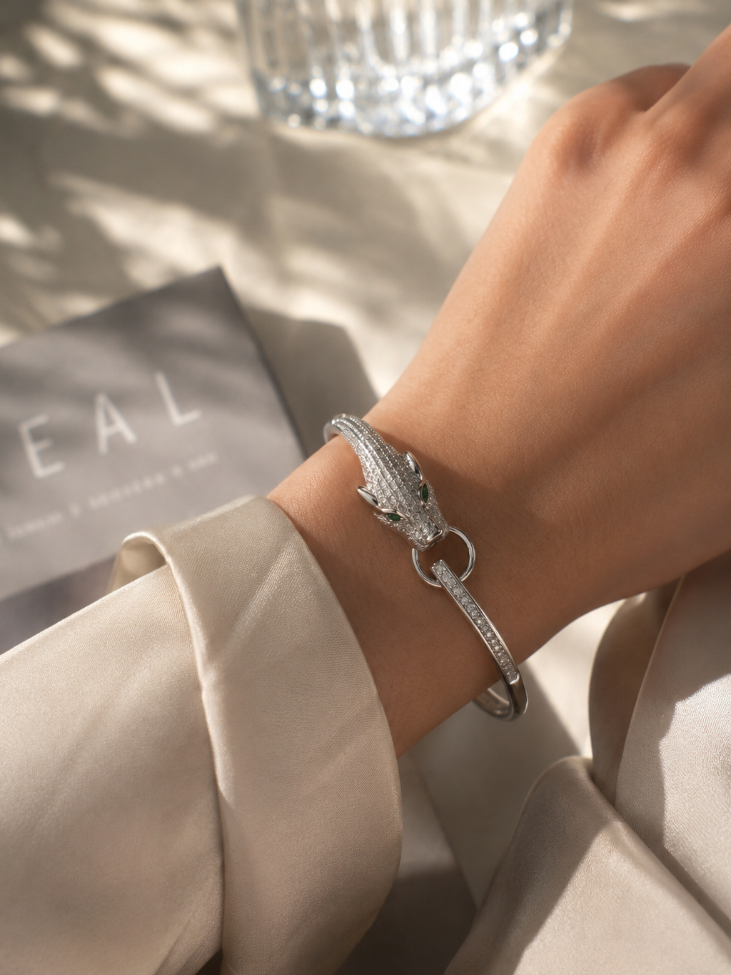 Anti-tarnish panther head cuff bracelet featuring a detailed silver-tone panther with sparkling stone embellishments and green eyes