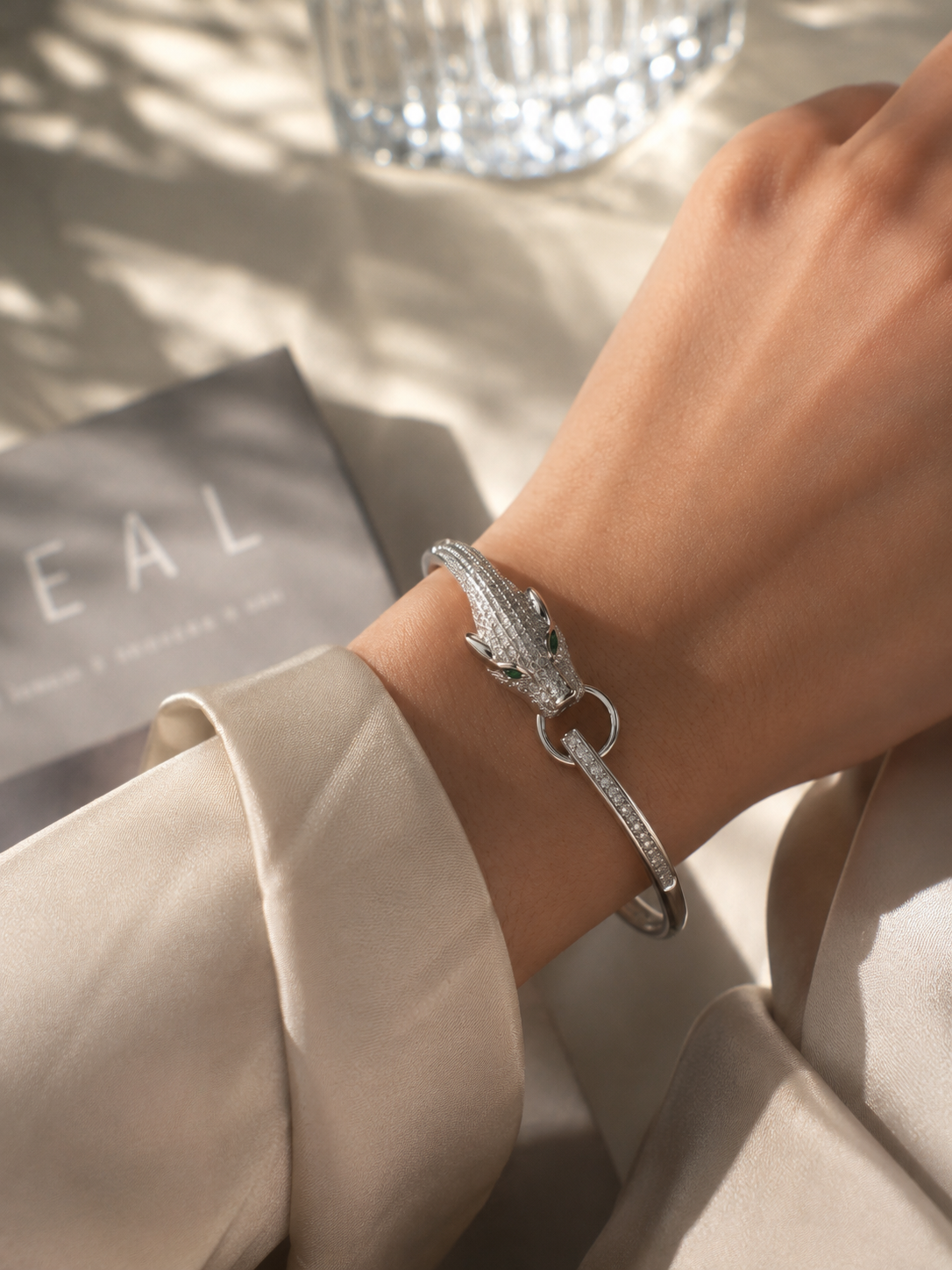 Anti-tarnish panther head cuff bracelet featuring a detailed silver-tone panther with sparkling stone embellishments and green eyes