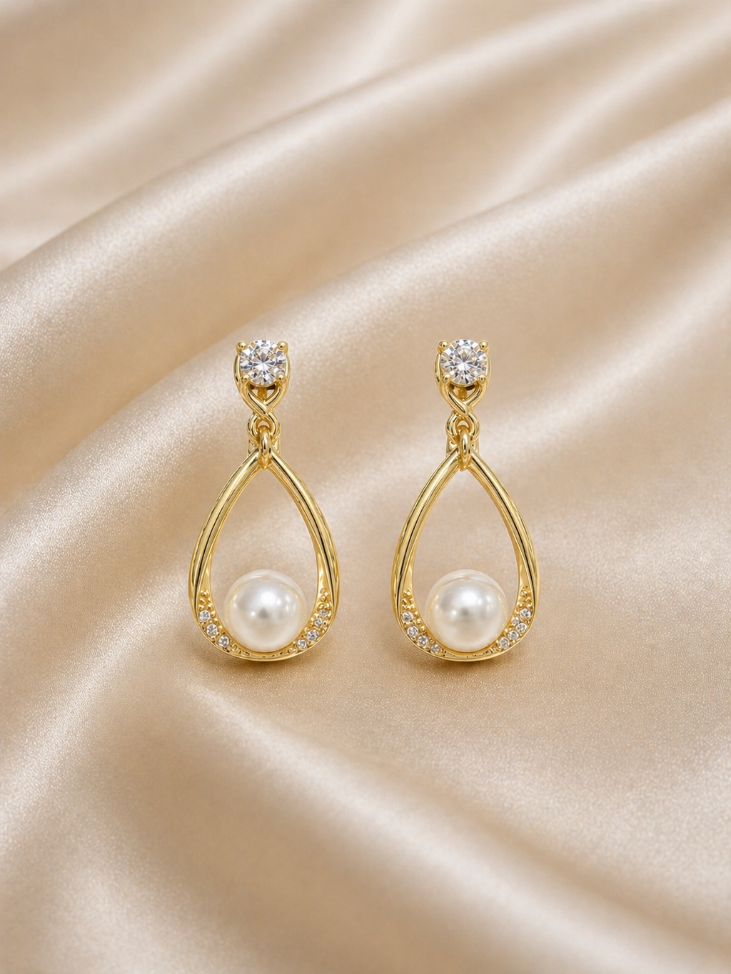 Anti-tarnish pearl drop dangling earrings for women in gold finish, lightweight comfort jewellery by Ashaarya with elegant teardrop design