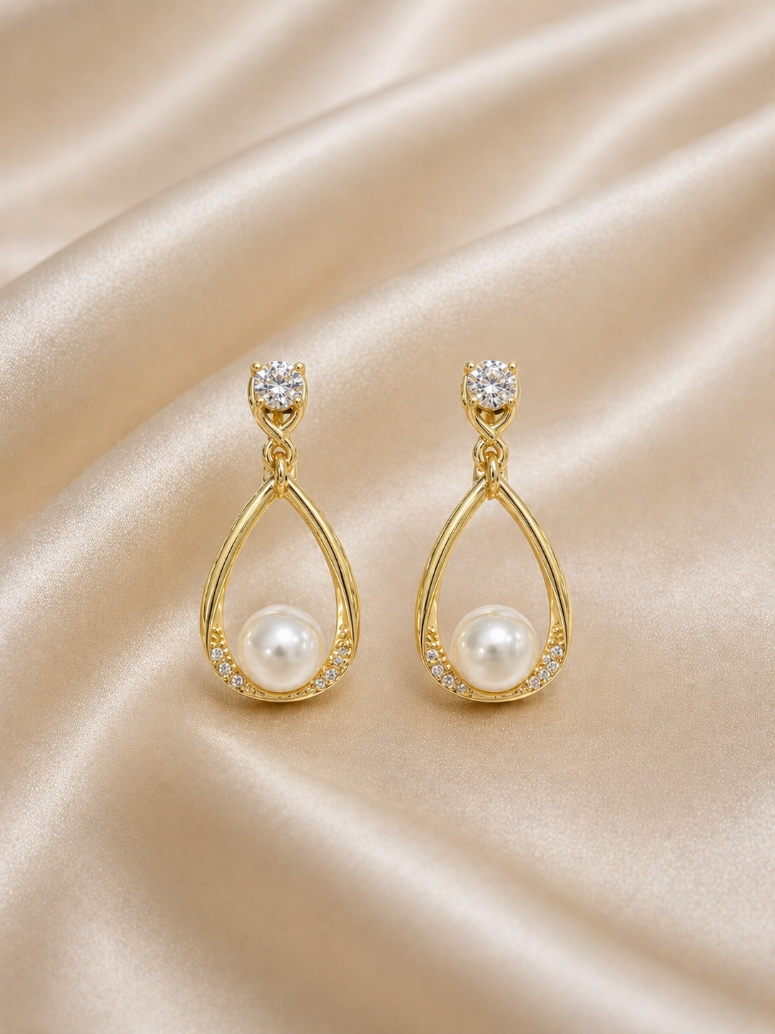 Anti-tarnish pearl drop dangling earrings for women in gold finish, lightweight comfort jewellery by Ashaarya with elegant teardrop design