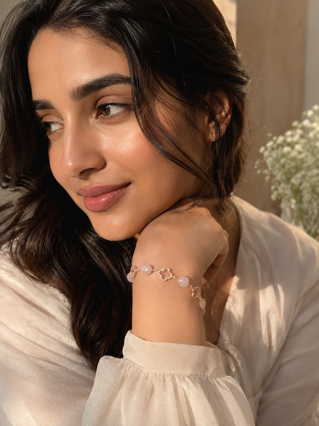 Anti-tarnish pink gemstone bracelet featuring multiple soft pink stones and elegant clover-shaped crystal charms