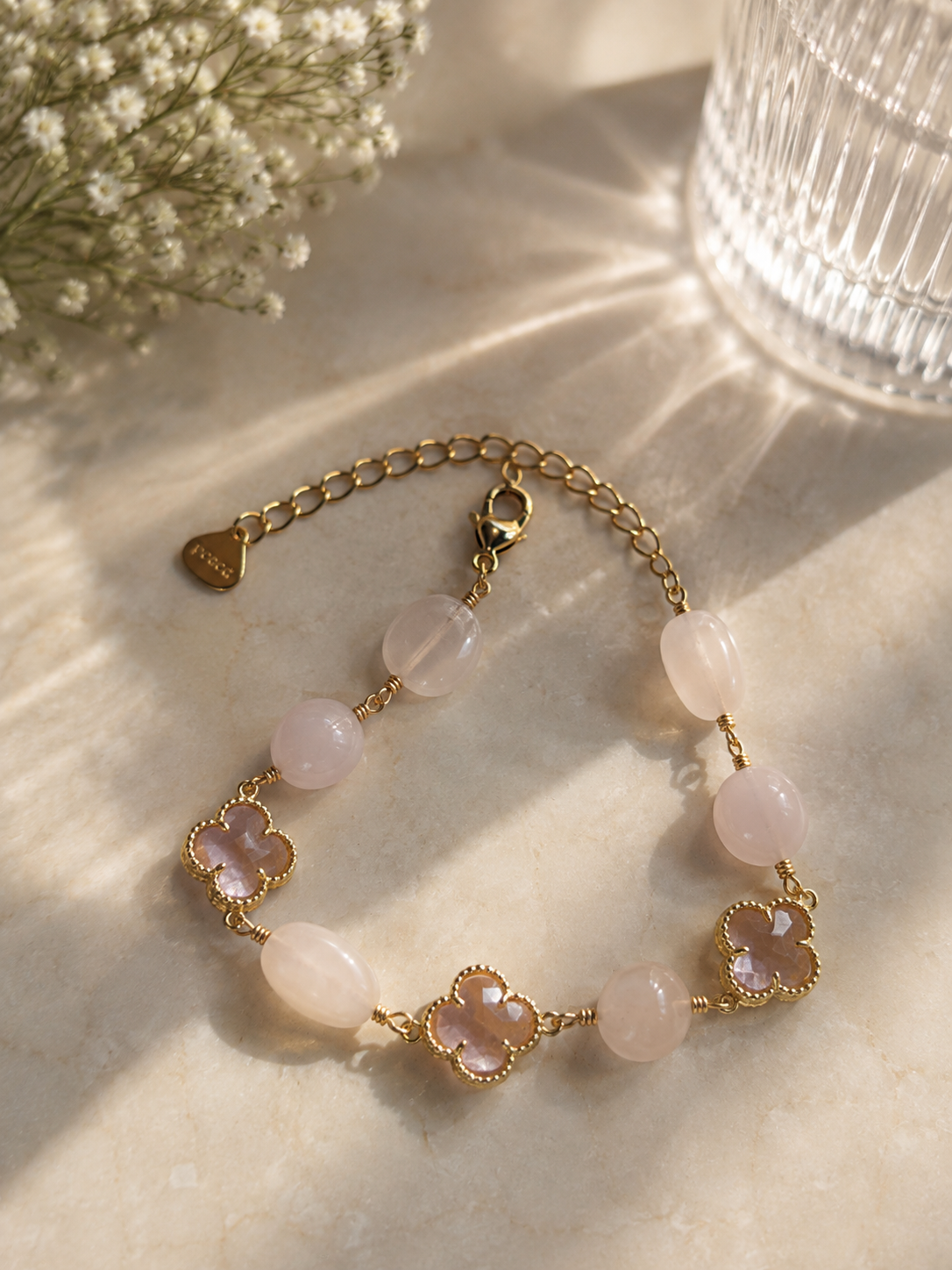 Anti-tarnish pink natural stone bracelet for women featuring soft pink stones, delicate clover charms and gold-tone detailing