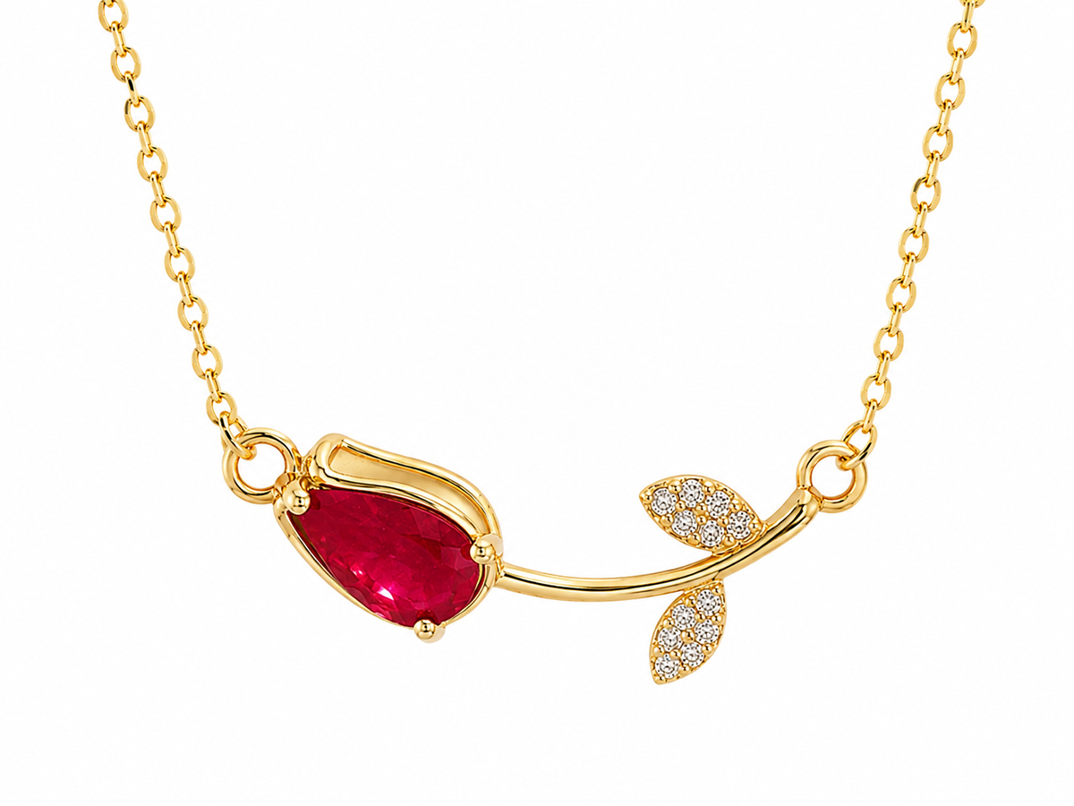 Anti-tarnish red stone necklace for women with a minimalist gold-tone chain and delicate botanical-inspired pendant