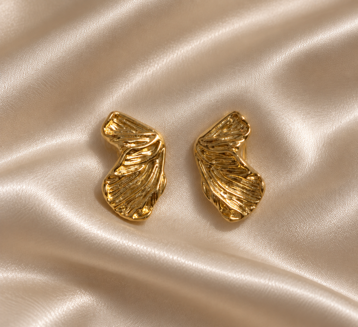 Anti-tarnish sculpted gold clip-on earrings by Ashaarya featuring an elegant textured design, perfect comfort jewellery for women without pierced ears