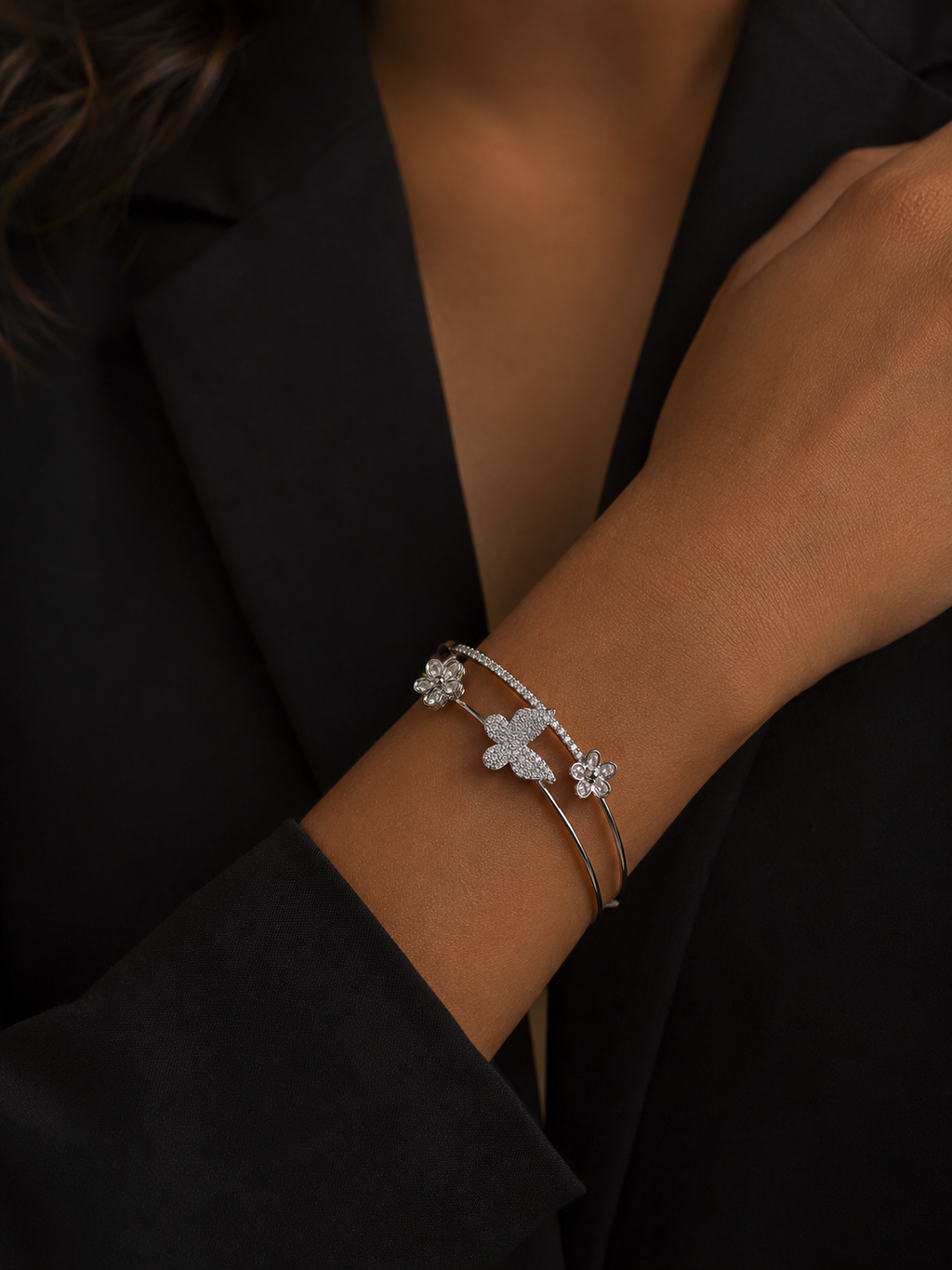 Silver-tone butterfly bracelet with sparkling stones and delicate floral accents by Ashaarya.