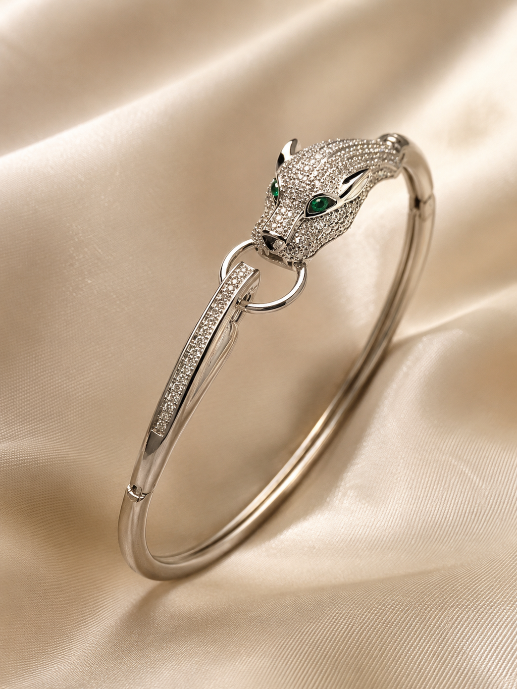 Anti-tarnish silver panther bracelet for women featuring a detailed panther head with sparkling stones and green gemstone eyes