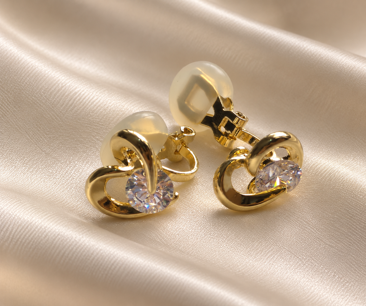 Anti-tarnish small gold heart earrings with clip-on fastening and clear gemstone detail, perfect for women without pierced ears