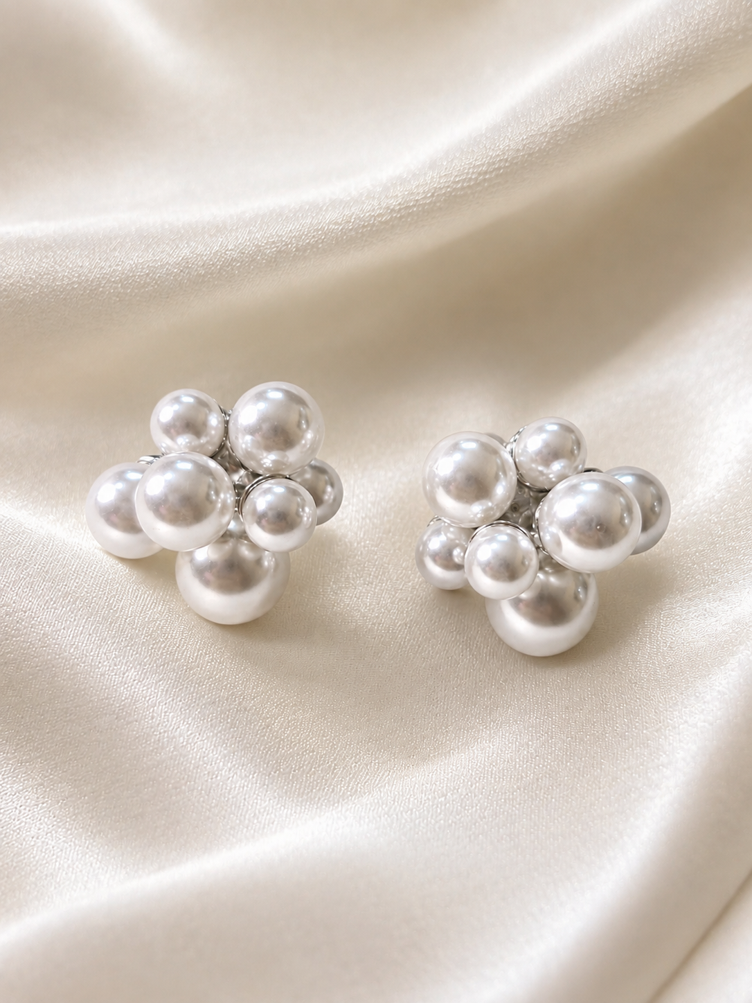 Anti-tarnish white pearl clip-on earrings with silver-tone detailing, designed for elegant everyday wear without pierced ears