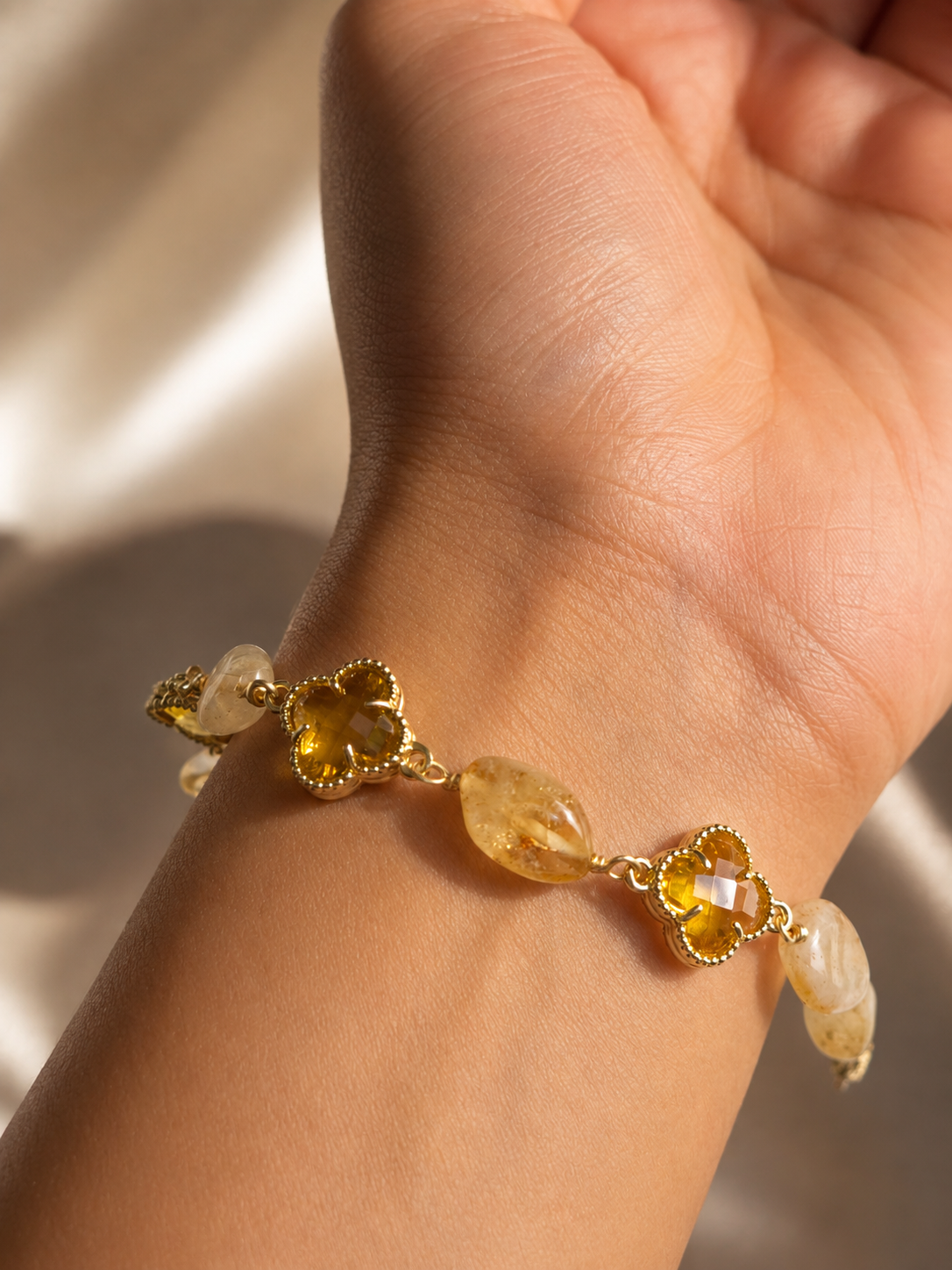 Anti-tarnish yellow gemstone bracelet featuring faceted floral accents and organic-shaped yellow stones for an elegant everyday look