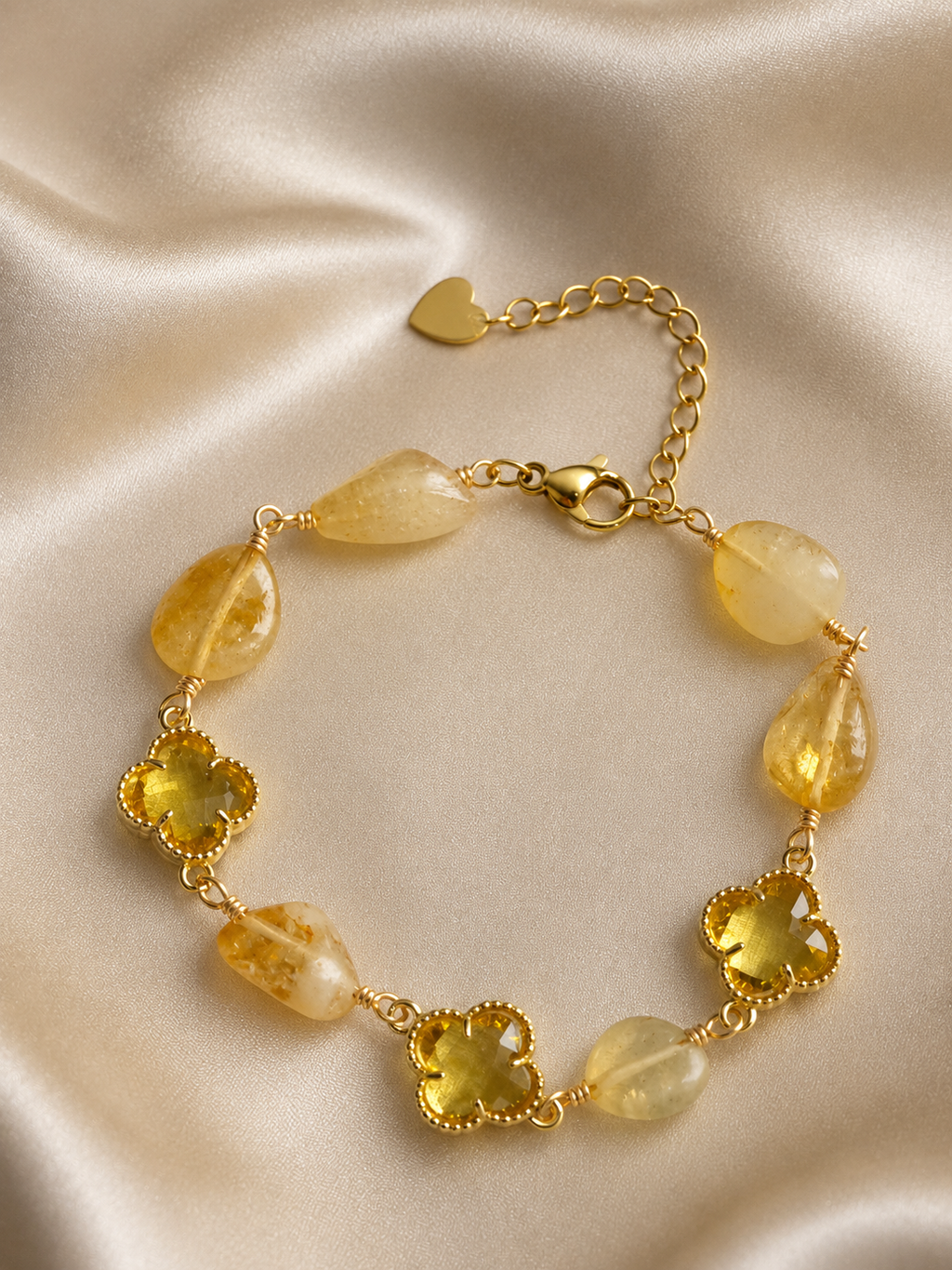 Anti-tarnish yellow natural stone bracelet for women featuring faceted yellow stones, clover-shaped crystal accents and gold-tone detailing