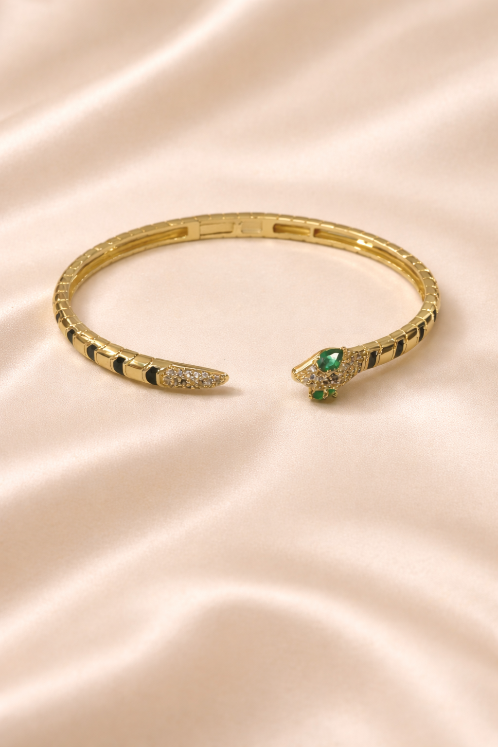anti-tarnish comfort jewellery snake bracelet for women with American diamonds and emerald stones in 18kt gold tone luxury bracelet