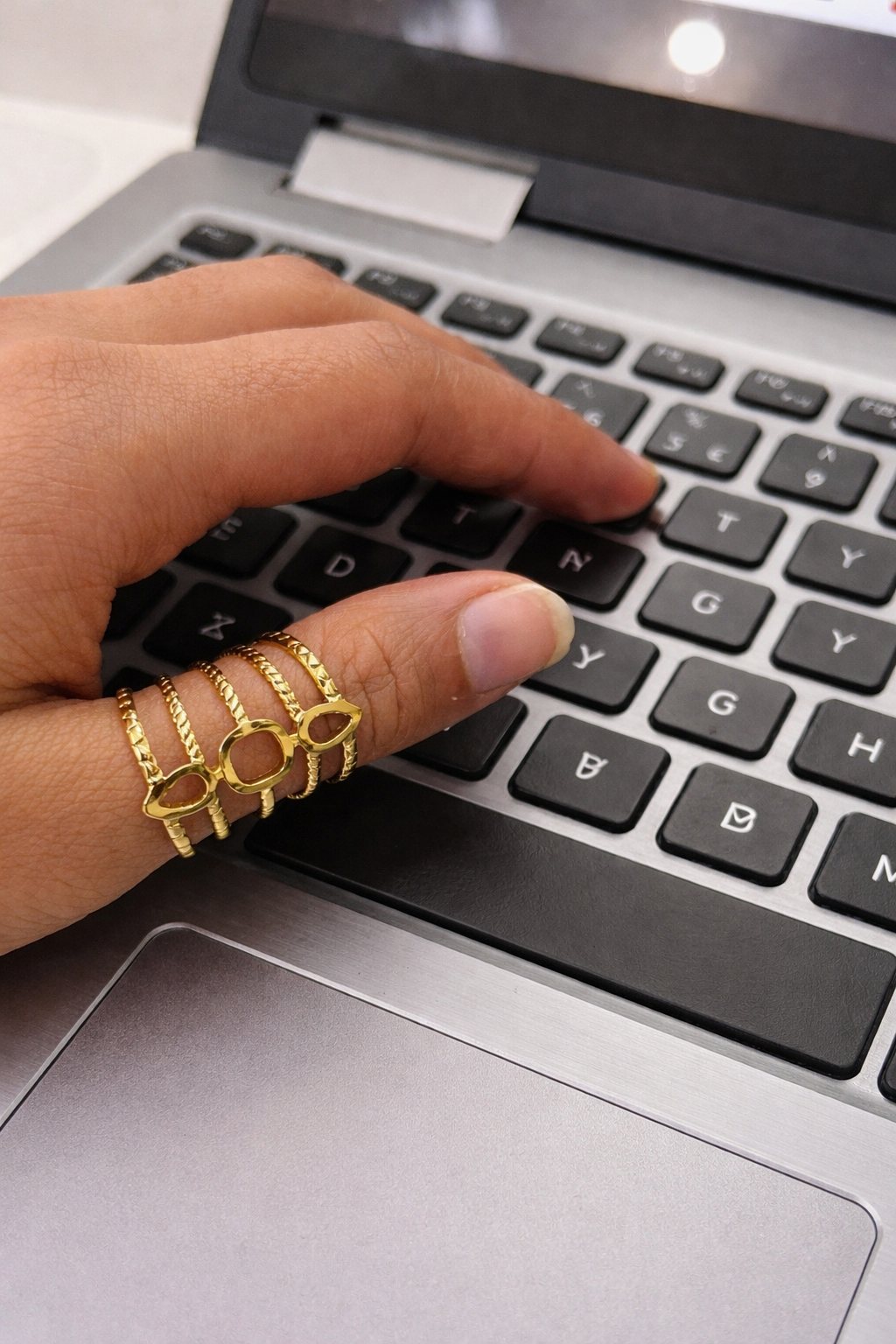 Anti-Tarnish, Ashaarya, Ashaarya Jewels, Ashaarya Jewellery, Hand with gold rings on a laptop keyboard