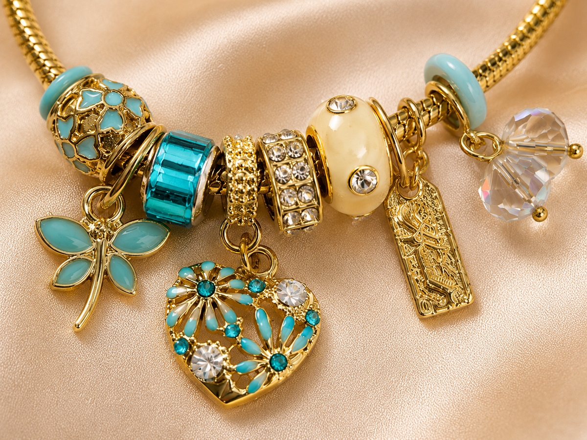 Close-up of turquoise floral charms and crystal accents on Neel Tara comfort jewellery charm bracelet