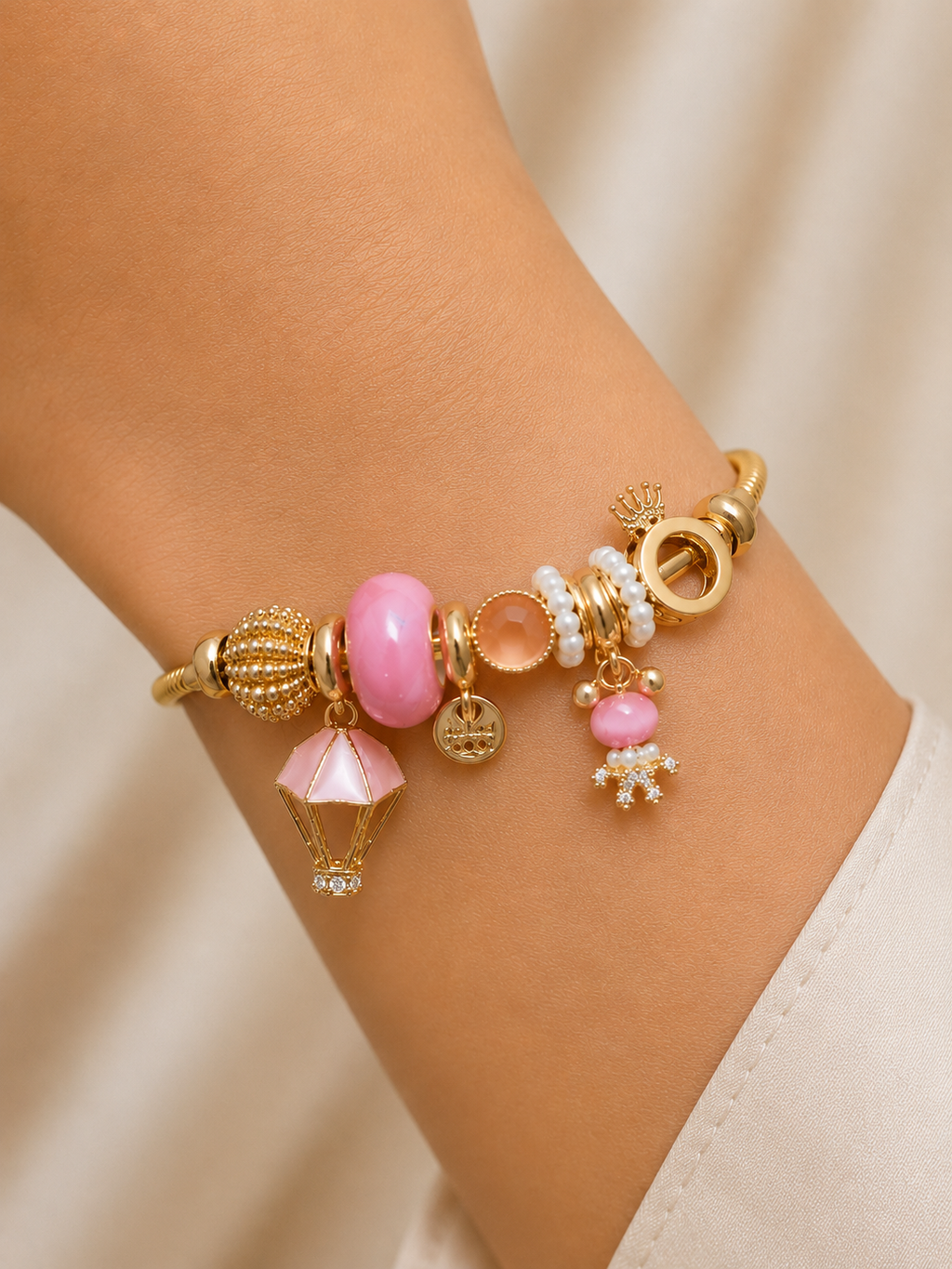 Pink Postcards anti-tarnish charm bracelet for women with blush pink charms, pearl accents and hot air balloon charm