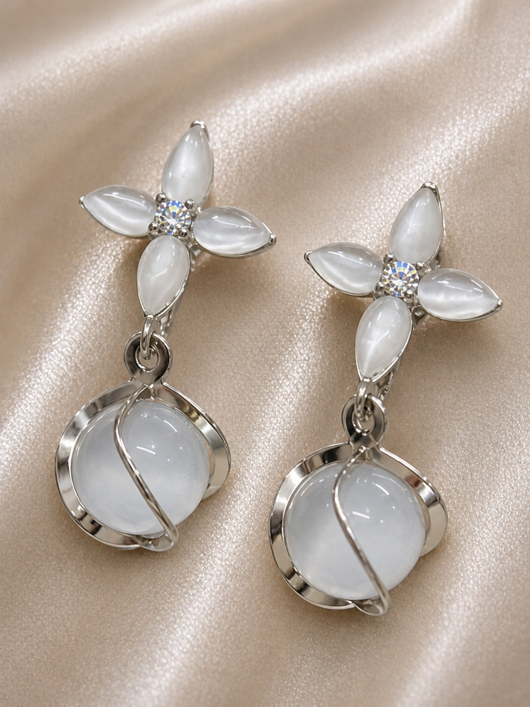 Close-up of Noctra star clip-on earrings, anti-tarnish comfort jewellery for women with minimal celestial design and soft drop detail