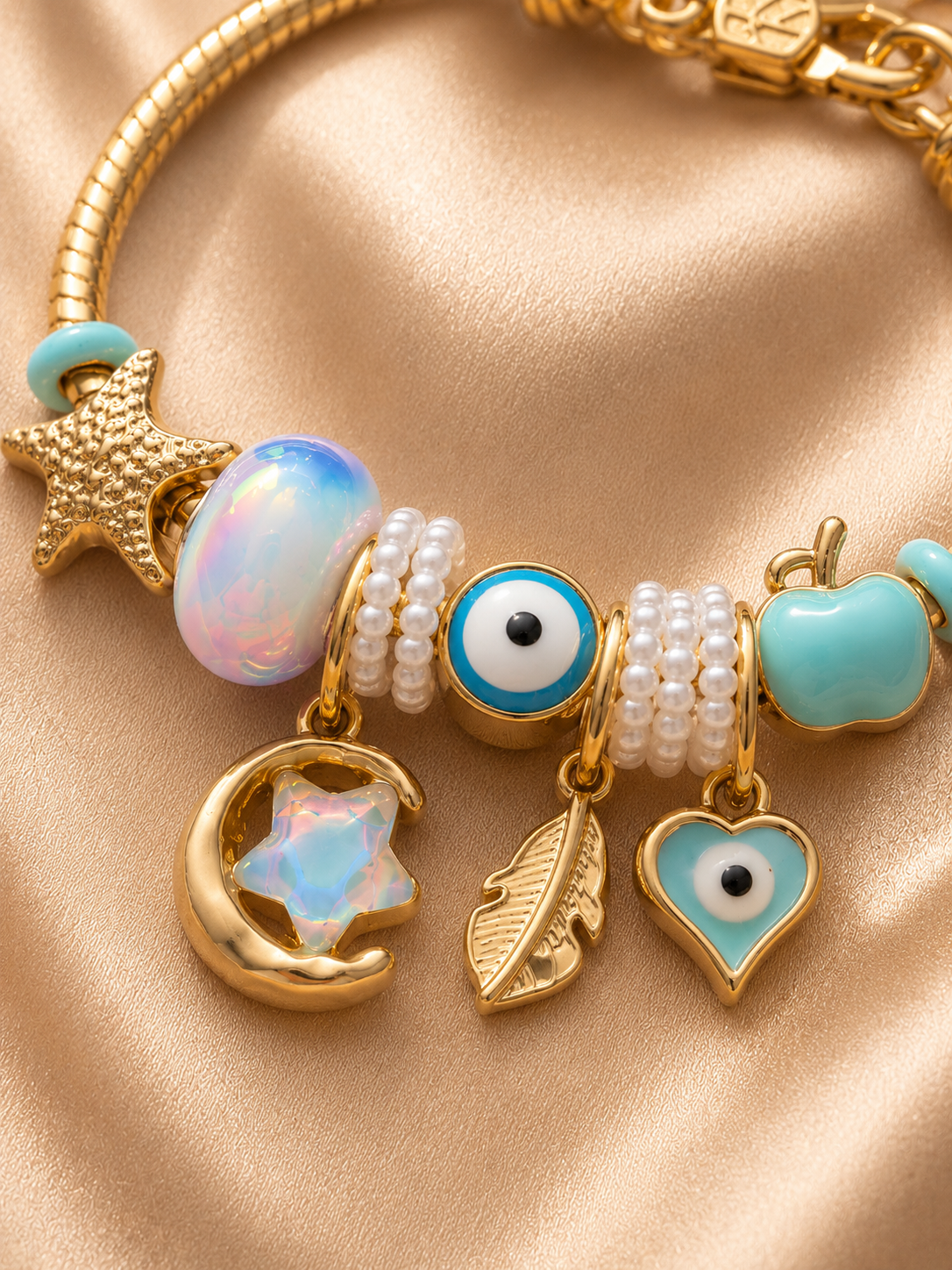 Close-up of Chaand Nazar charm bracelet featuring celestial moon charm, pastel blue beads and evil eye detailing.