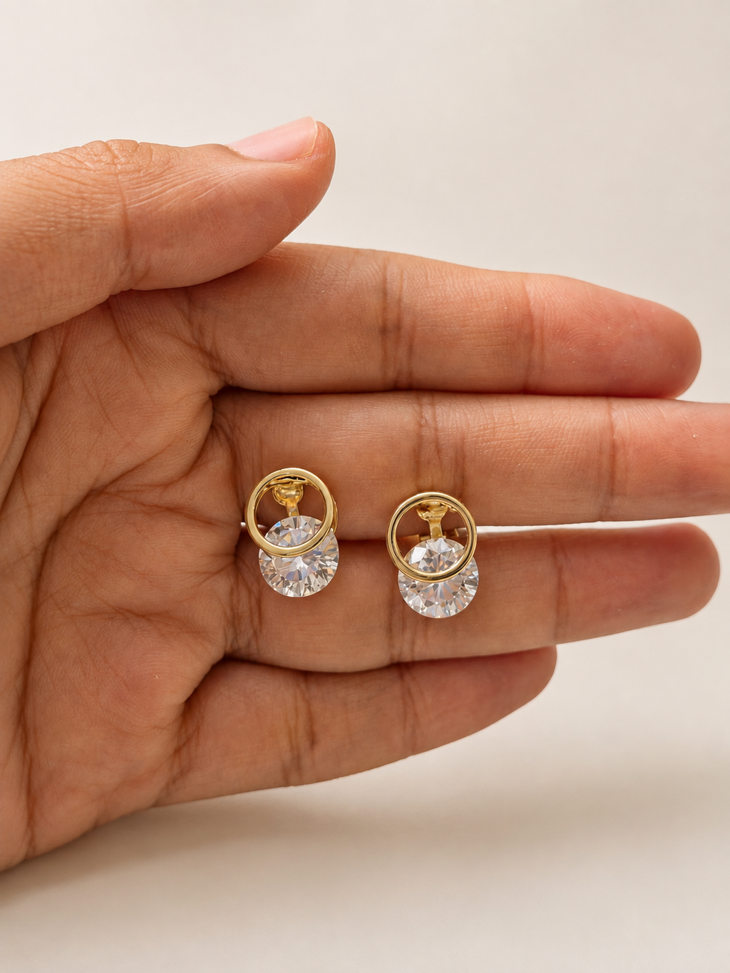 Crystal clip-on earrings for girls with elegant gold-tone detailing and a statement sparkling stone design