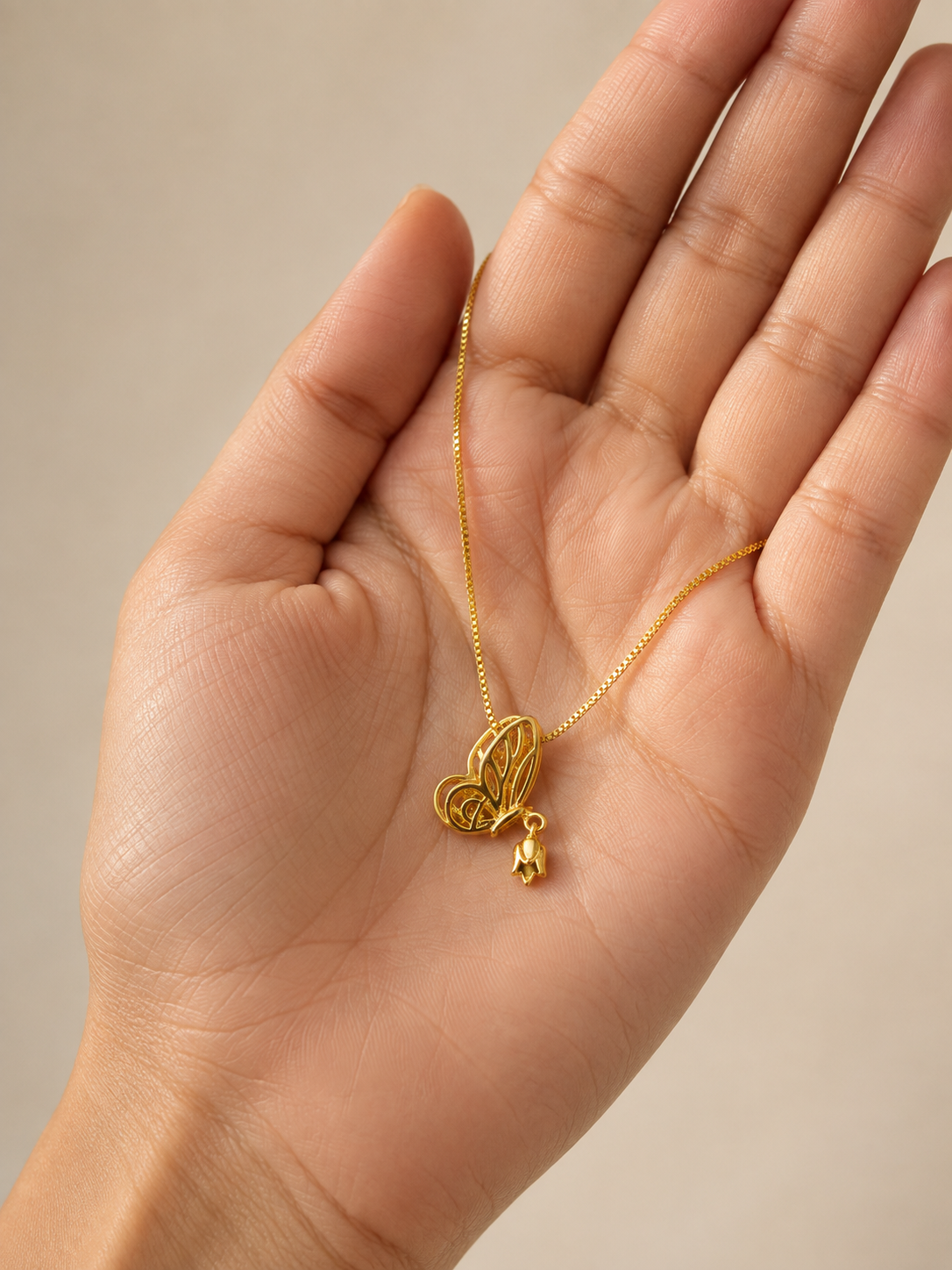  Delicate butterfly pendant on an 18KT gold-tone necklace by Ashaarya.