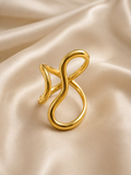 Élan Wave Ring by Ashaarya adjustable 18KT gold tone statement ring for women on champagne satin background